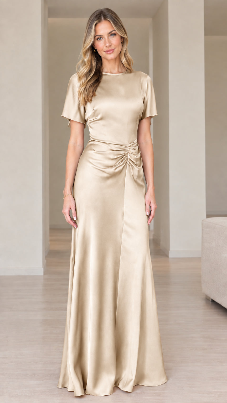 Front view of woman wearing champagne gold short sleeve ruched maxi dress