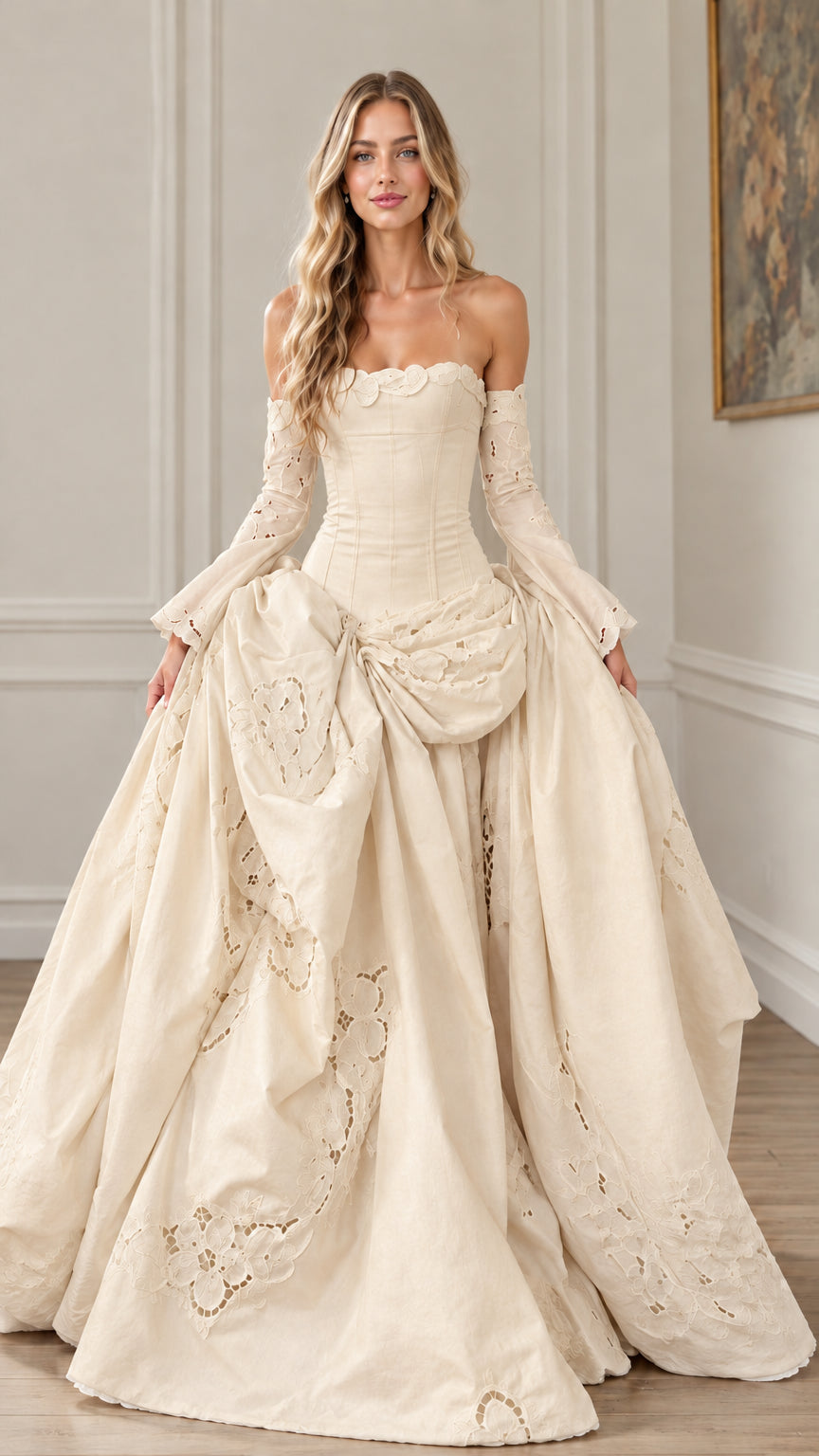 Front view of champagne ivory off-the-shoulder corset ball gown with draped skirt details