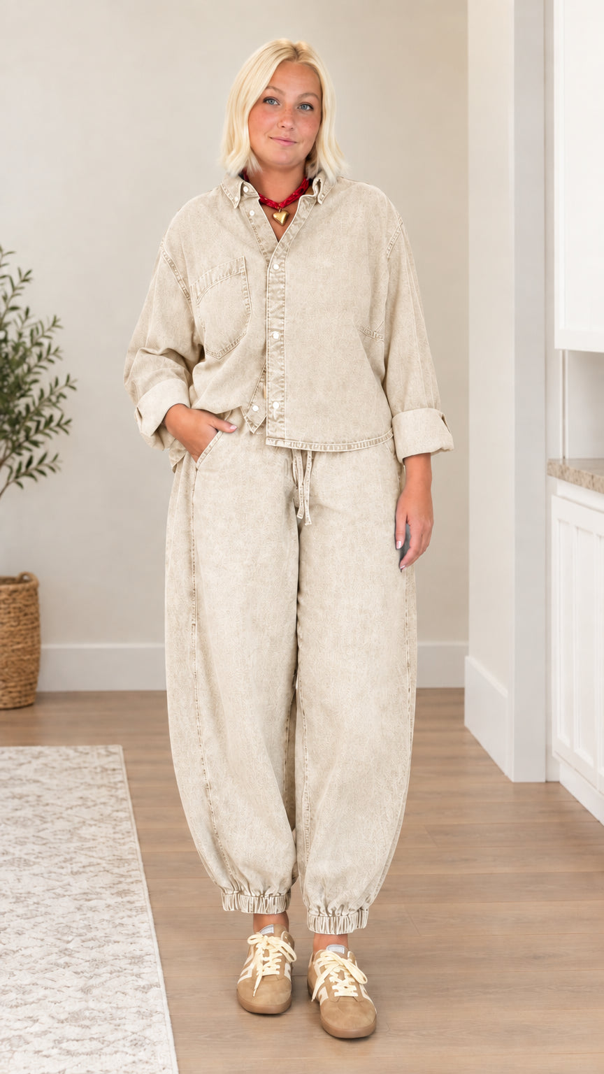 Model wearing khaki beige washed denim matching shirt and pants set