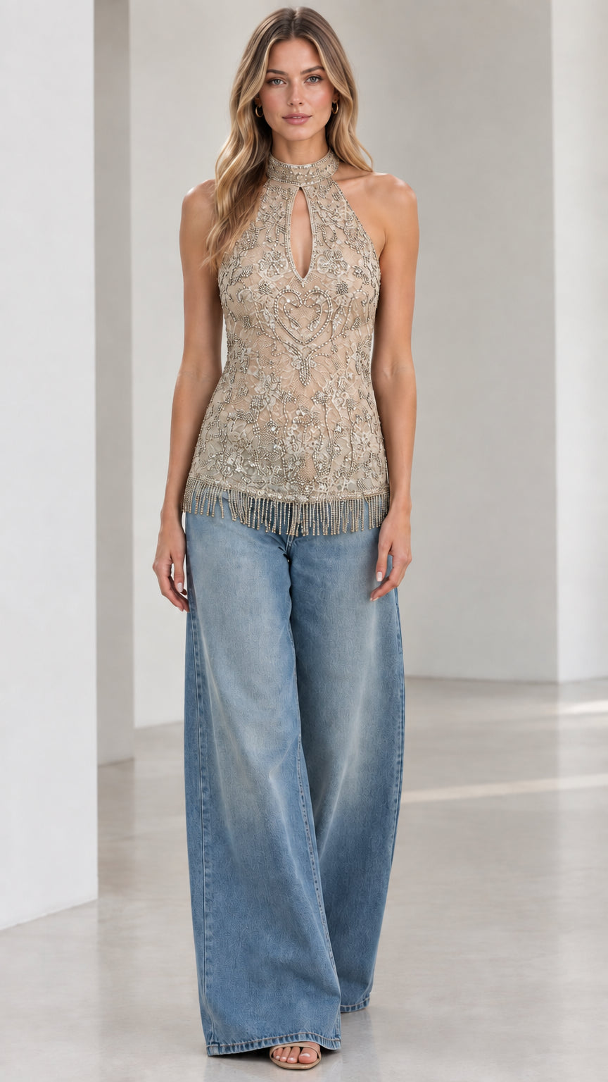 Champagne gold embellished halter neck top with beaded fringe and wide-leg jeans