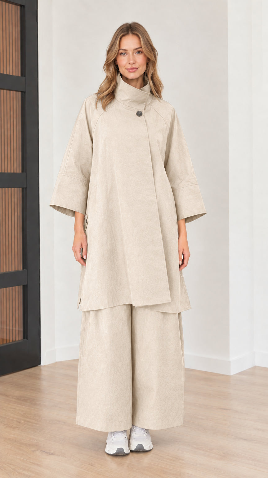 Front full view of women's mock neck tunic top and wide-leg pants two-piece set in beige