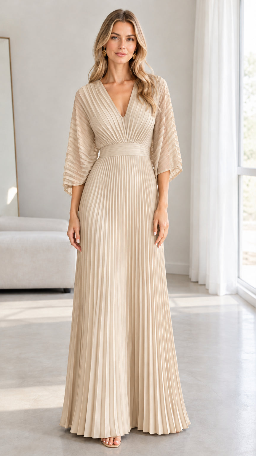 Front view of model wearing the champagne beige pleated maxi evening dress